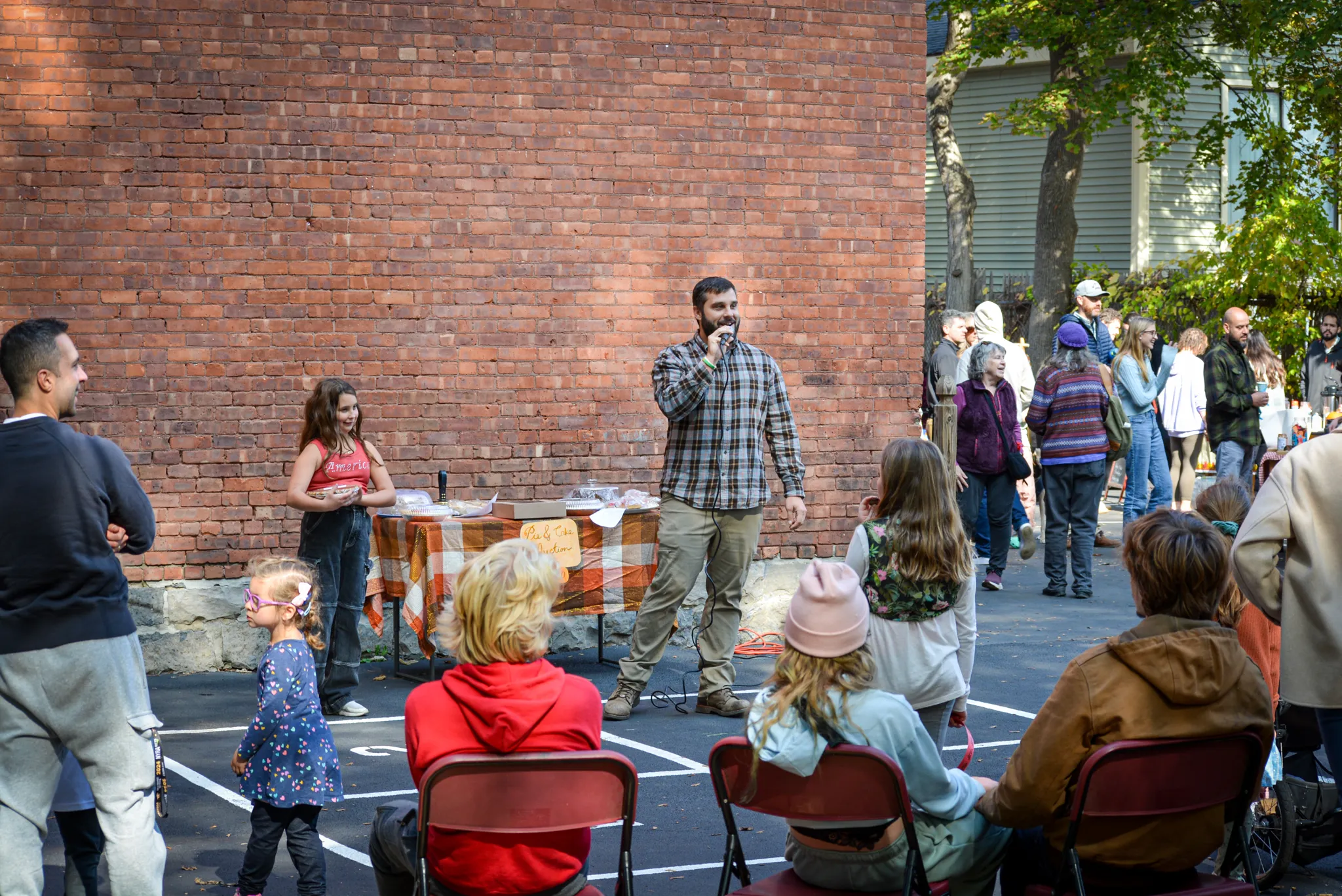 Families gathered at an outdoor community event on campus