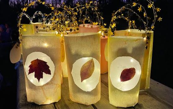 Handmade lanterns glowing with pressed autumn leaves