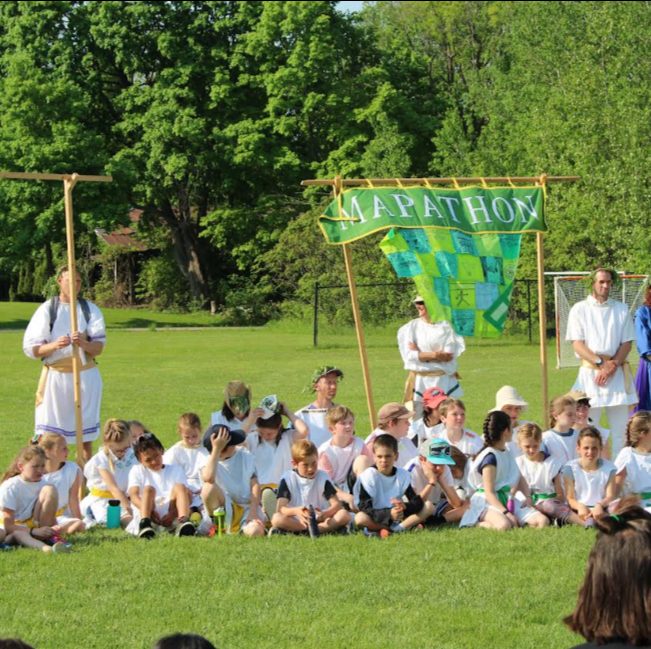 The school community gathered on the lawn for a May Day celebration