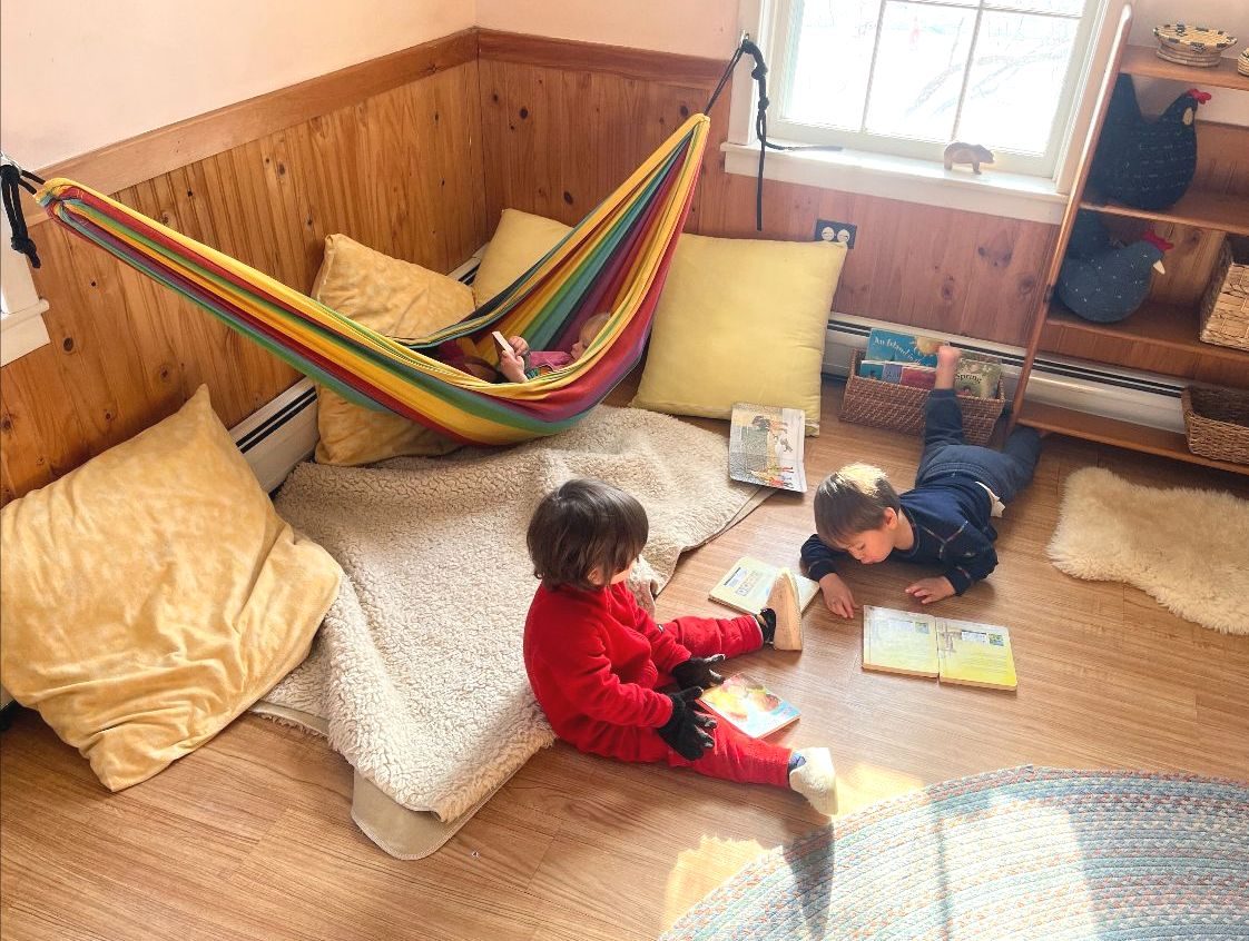 A cozy reading and play corner in an Early Childhood classroom