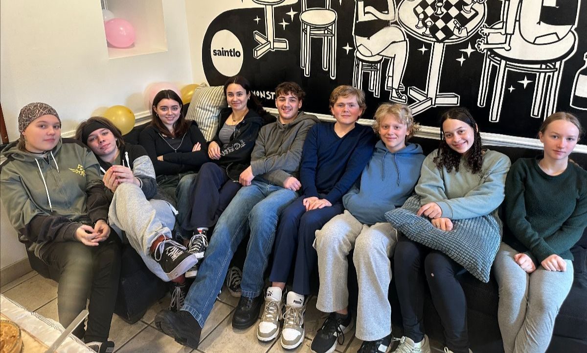 A group of students together at the end of a class trip